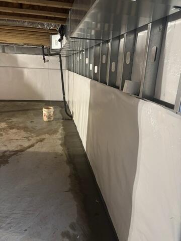 Installed to capture and redirect groundwater away from the foundation, our WaterGuard Drainage System prevents water from pooling in the basement and protects the home from long-term moisture damage.