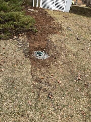 LawnScape was installed at the discharge point to direct water safely away from the home without disrupting the yard.