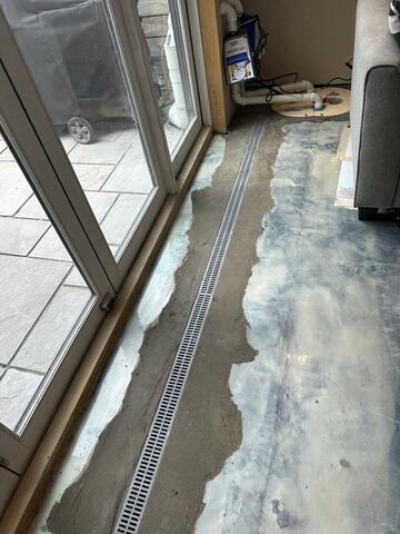 Added to capture surface water at key entry points, our TrenchDrain System prevents water from spreading across the basement floor and directs it safely to the drainage system.