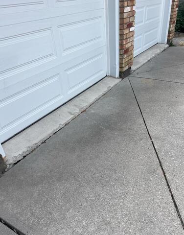 See that ledge? A sunken garage floor like this Dundas home is a prime tripping hazard for kids. We fix these by lifting the concrete back to a flush, safe finish.