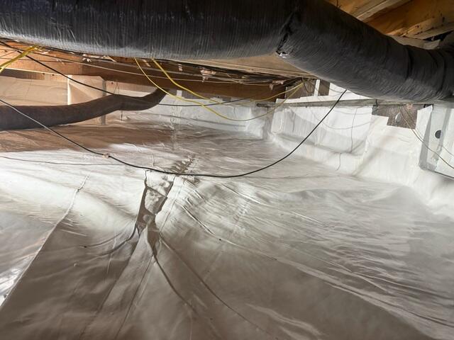 Our CleanSpace Vapor Barrier System acts as a strong, sealed barrier between the crawl space and the earth, preventing ground moisture and humidity from entering the space.