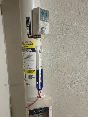 During: Our Foreman, Gus, and his crew secured the Radon Mitigation System in the home.