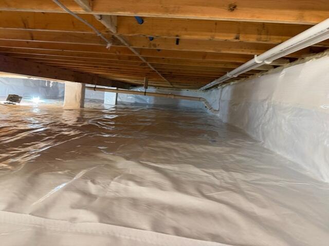 The CleanSpace Vapor Barrier System was installed to fully encapsulate the crawl space and block moisture from the ground and surrounding air.