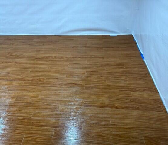 The Elite Plank Flooring in Walnut gives this basement a finished look while being completely waterproof.