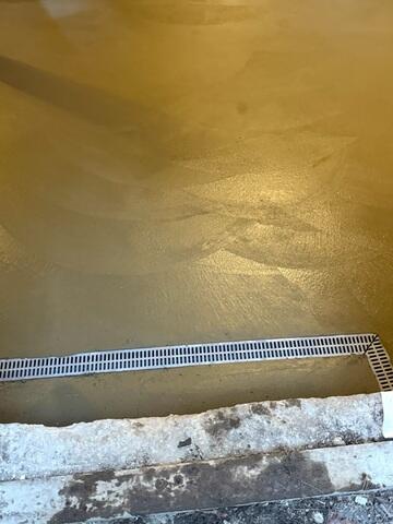 The Trechdrain system will collect any water sneaking into the basement via the doorway entrance.