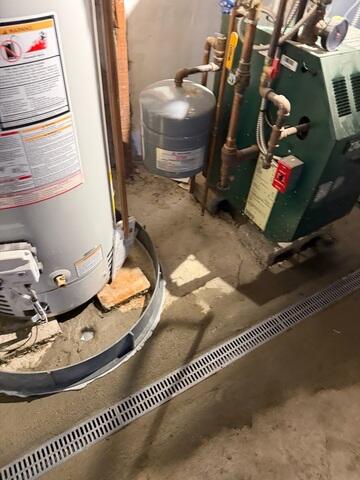 TrenchDrain was installed to capture surface water at key entry points before it could spread across the basement floor.