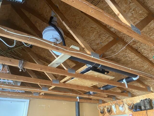 During: Our Foreman, Gus, secured the system above the garage.