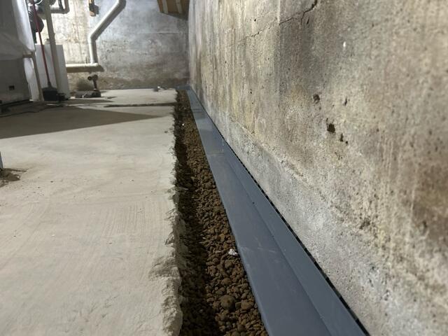 During: Our Foreman, Kiko, and his crew dug and placed the WaterGuard along the basement perimeter.