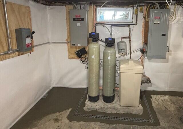 The TrenchDrain grated basement drain is installed around some utilities in the basement to protect them by catching surface water. It is connected to the WaterGuard drainage system.