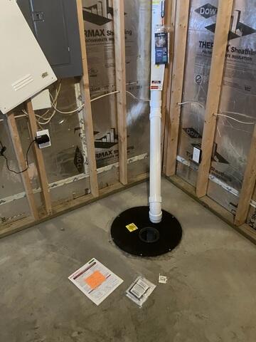 During: Our Foreman, Gustavo, secured a Radon Mitigation System inside and outside the home.