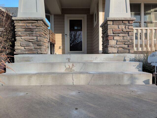 During: The crew successfully lifted and leveled the sidewalk back into place.