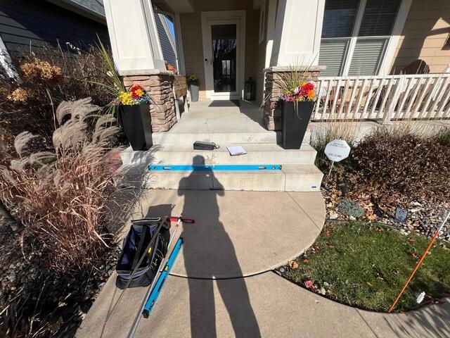Before: Our Design Specialist, Gary, recommended lifting the sunken slabs and sidewalk back to its original level.