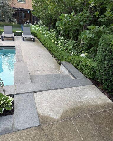 A stunning Kleinburg poolside retreat where we stepped in to fix settling concrete. This view shows the walkway and stairs we stabilized to ensure a safe, seamless path to the lounge area.