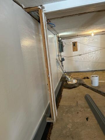 During: Our Foreman, Kiko, and his crew secured the waterproofing products throughout the basement.