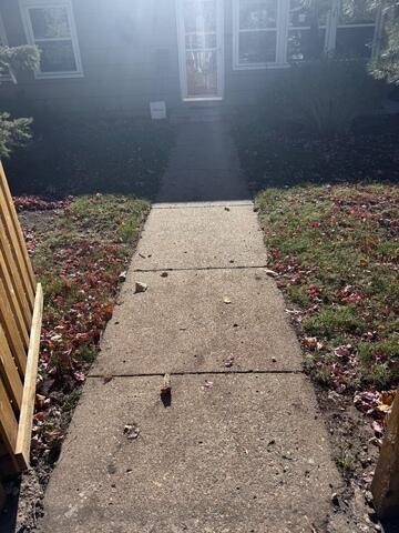 Before: Our Design Specialist, Tony, recommended leveling and repairing the damaged concrete.