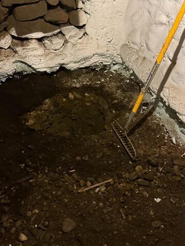 The wet dirt floor in the Burlington, Vermont, homeowner's basement.