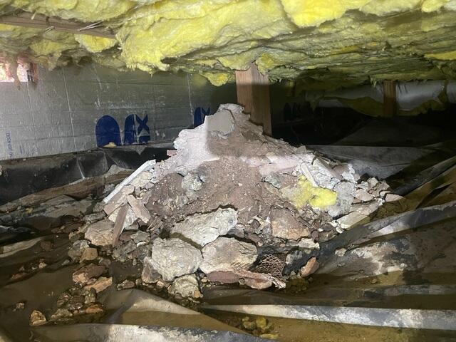 This crawl space was filthy and full of piles of debris