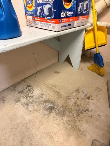 Water damaging the basement floor.