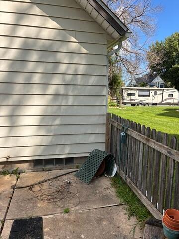 Before: Our Design Specialist recommended securing a Radon Mitigation System outside the home.