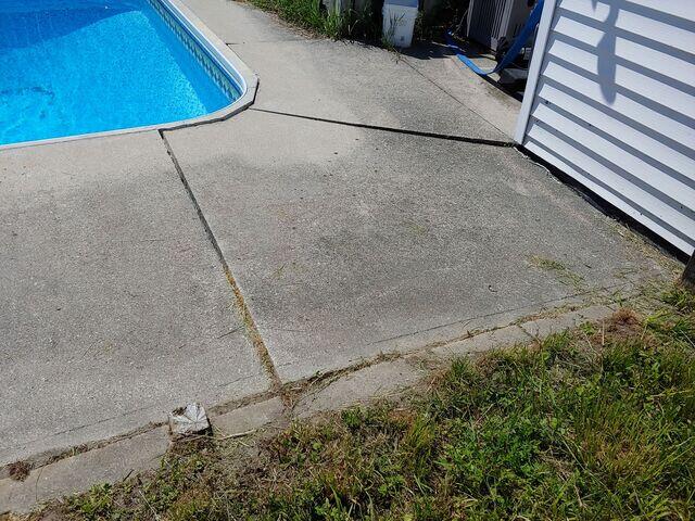 Don't rip and replace-level it. We fixed this dangerous settlement in Oro-Medonte by injecting high-density foam to lift and support the concrete permanently. A seamless finish at a fraction of the cost.