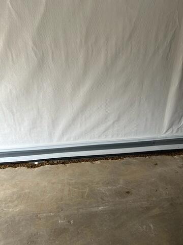 During: Our Foreman, Kevin, and his crew secured all the waterproofing products throughout the basement.