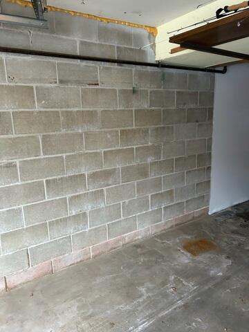 Before: Our Design Specialist, Dustin, recommended securing several waterproofing products throughout the garage.