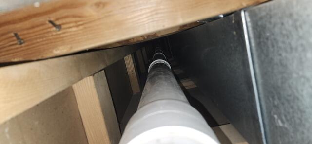 Looking through the chase and the multiple sections of pipe.