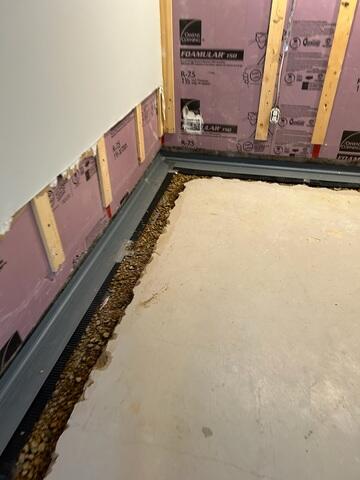 During: Our Foreman, Kevin, and his crew recommended installing several waterproofing products throughout the basement.