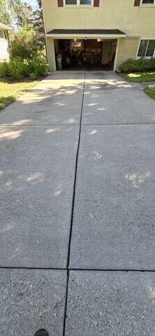 Before: Our Design Specialist, Greg, recommended lifting the walkway to match the front steps.