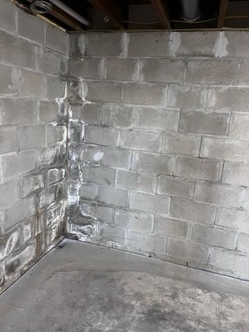 Before: The Design Specialist recommended securing several waterproofing products throughout the basement.