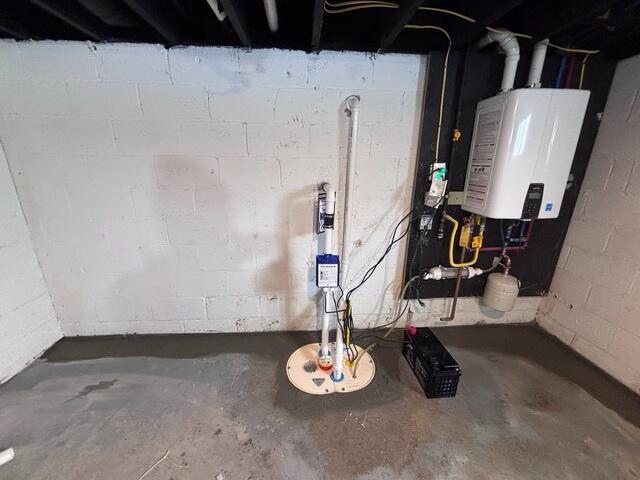 TripleSafe sump pump installed in Berkeley Heights, NJ connected to the full-perimeter WaterGuard drainage system, providing three levels of protection and continuous groundwater removal for complete basement waterproofing.