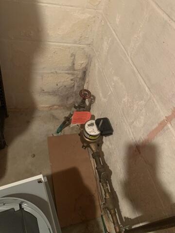 Before: Kyle, our Service Technician, recommended securing several waterproofing products throughout the basement.