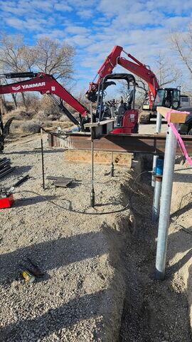 Load test setup and bracket assembly used to confirm pier capacity. Each installed pier was verified to meet design loads before structural integration.
