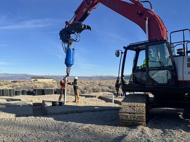 Experienced crew and specialized high-torque installation equipment working together to advance production helical piers on site.