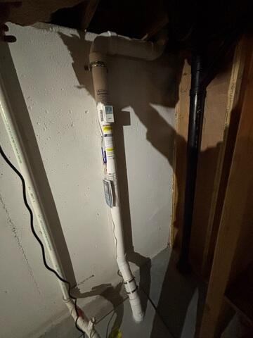 During: Our Foreman, Dakota, and his crew secured the Radon Mitigation System in the home.