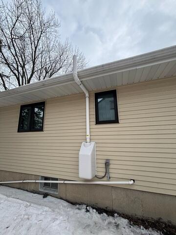 During: Our Foreman, Dakota, and his crew secured the Radon Mitigation System in the home.