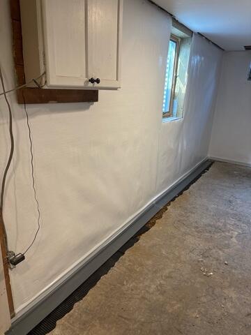 During: Our Foreman, Diego, and his crew secured several waterproofing products along the water-damaged wall.