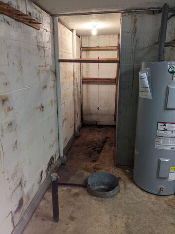 Before: Our Design Specialist, Eric, suggested waterproofing the entire basement.