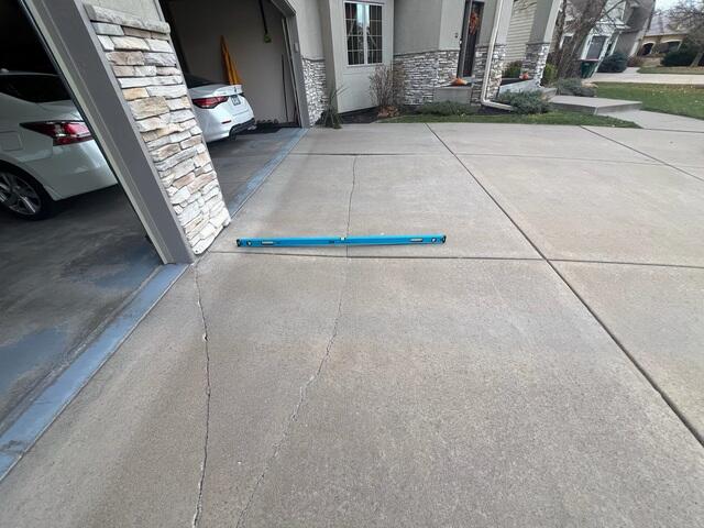Before: Gary, one of our Design Specialists, recommended lifting and leveling the driveway back to its original position.