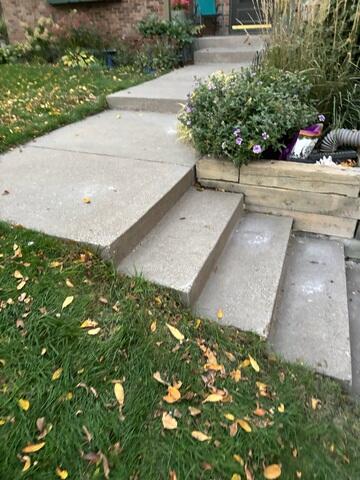 During: Our Foreman, Bryce, and his crew successfully lifted the sidewalk back to its original position.