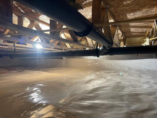 This crawl space is fully encapsulated with the CleanSpace vapor barrier to prevent ground moisture from entering the home.