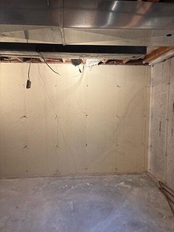 Before: Our Design Specialist, Jason, recommended waterproofing the water-damaged wall.