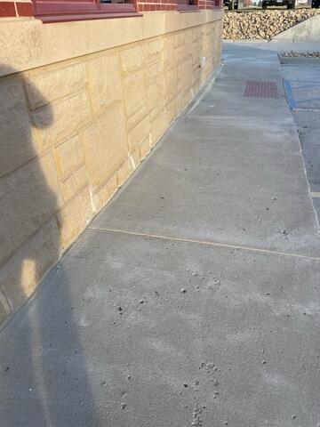 During: Our Foreman, Charlie, and his crew succesfully secured all the products below the damaged sidewalk.