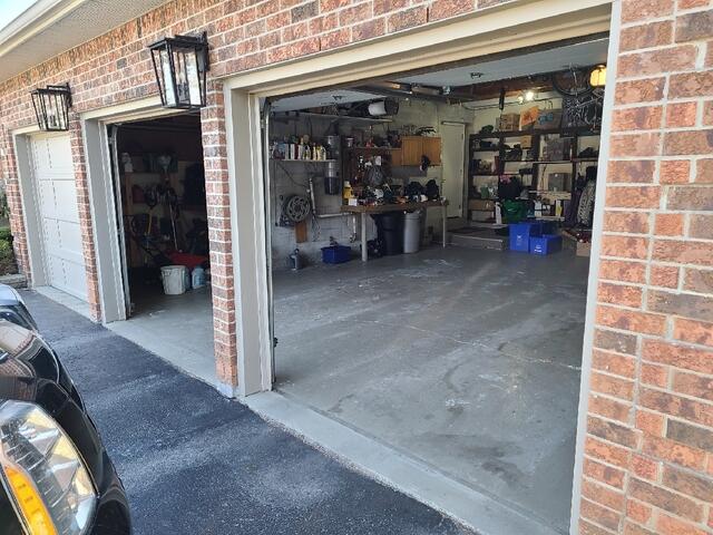 Three-car garage in Pickering with sunken concrete slabs and uneven floor, highlighting the need for professional garage slab repair and polyurethane concrete leveling.