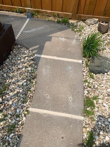 During: Our Foreman, Patrick, and his crew succesfully lifted and leveled the sidewalk back into place.