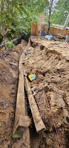 Our Crew removed the old fence, and dug out all of the crumbling soil.