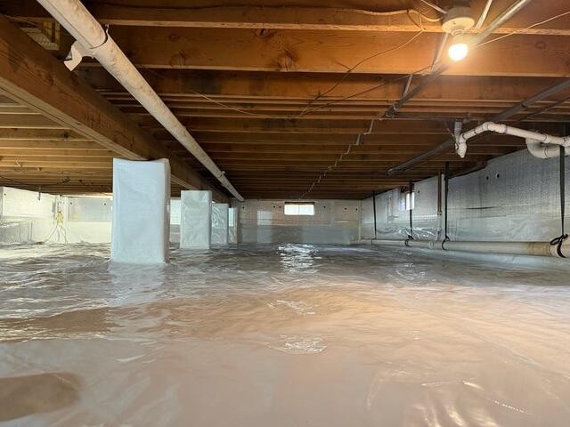 CleanSpace vapor barrier installed to seal the crawl space and block ground moisture from entering the home.