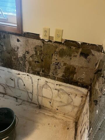 Before: Our Design Specialist, Ian, recommended waterproofing the struggling basement walls.