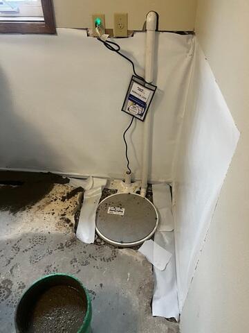 During: Our Foreman, Aaron, and his crew successfully secured all the waterproofing products in the basement.