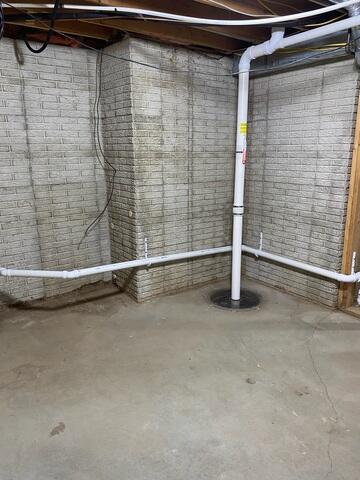 Before: Our Design Specialist recommended securing several waterproofing products throughout the basement.